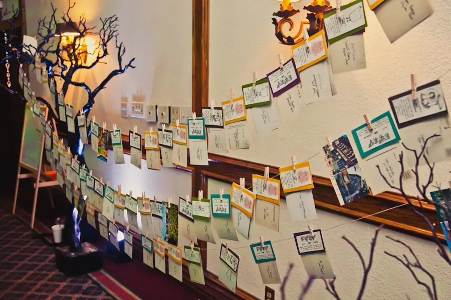 unique-wedding-reception-idea-escort-cards-hanging-clothes-pins.full
