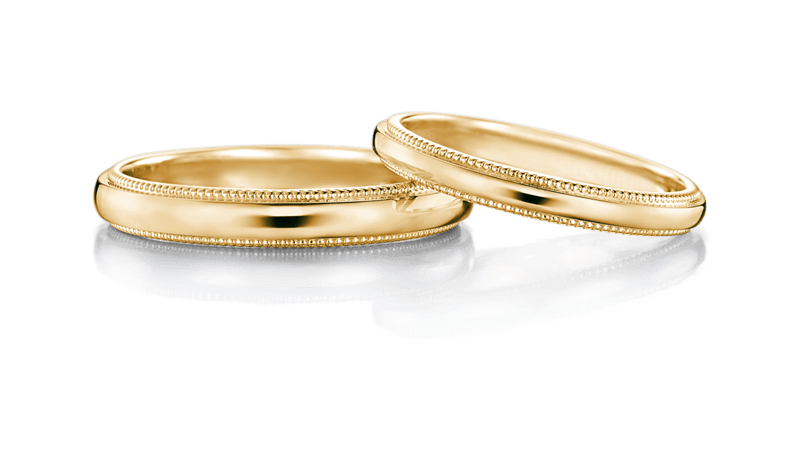 イエローゴールドのアームにミル打ちを施した結婚指輪、アイプリモのヘリオス